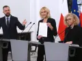 Trzy osoby przy mównicach, w tle flagi Polski i UE. Wibracja związku 8.